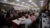 FILE - The Syrian Democratic Council meets in Tabqa, Syria, July 16, 2018.