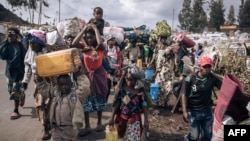 War-displaced people flee toward the city of Goma, Democratic Republic of Congo, on Nov. 15, 2022.