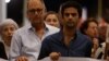 Peter Caruana Galizia, left, widower of late anti-corruption journalist Daphne Caruana Galizia, and their son Paul Caruana Galizia take part in a protest march on the sixth anniversary of her assassination, in Valletta, Malta, Oct. 16, 2023.