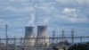 FILE- Bayswater Power Station, a coal-powered thermal power station, operates near Muswellbrook in the Hunter Valley, Australia, Nov. 2, 2021. 