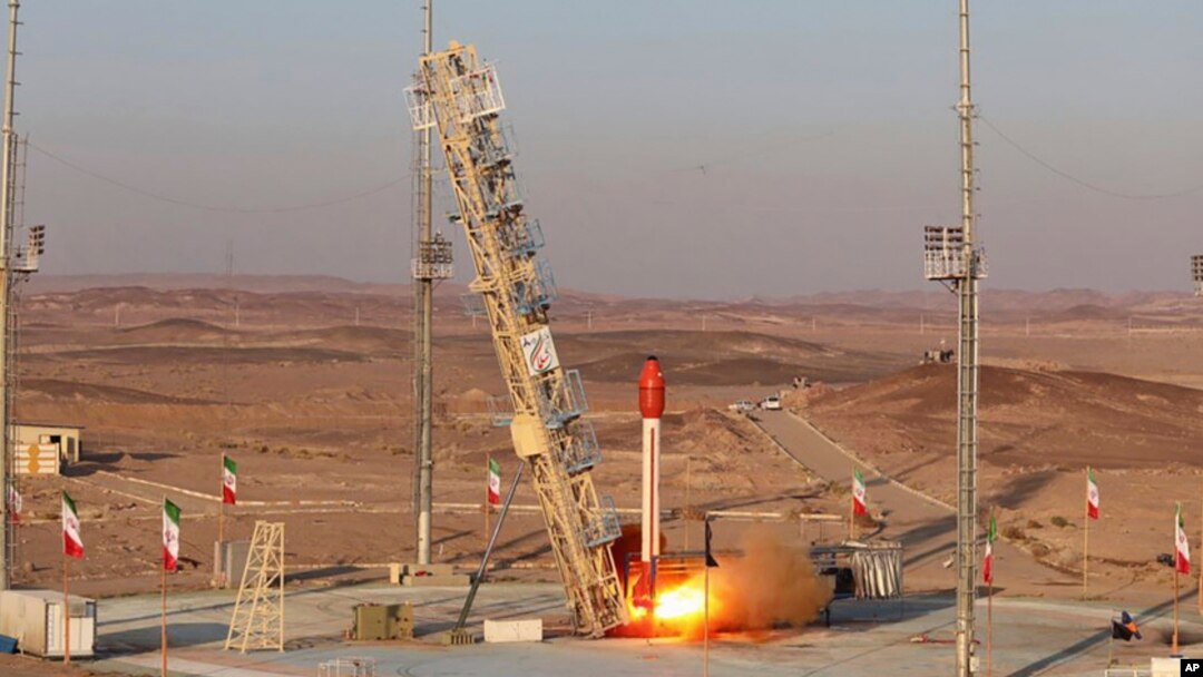 This photo released by the Iranian Defense Ministry on Dec. 6, 2023, claims to show a rocket with a capsule capable of carrying animals, being launched from an undisclosed location into orbit.