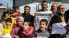 Palestinian men and children gather for a demonstration in Rafah in the southern Gaza Strip on Jan. 30, 2024, calling for continued international support to the United Nations Relief and Works Agency for Palestine Refugees in the Near East (UNRWA).