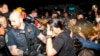 Officers of the Metropolitan Police Department pepper spray demonstrators at George Washington University, May 8, 2024, in Washington.