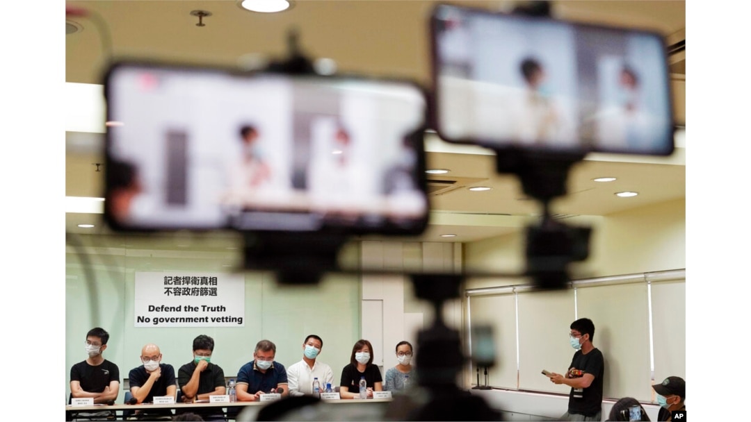 FILE - Representatives of Hong Kong media organizations attend a press conference in Hong Kong, Sept. 24, 2020.