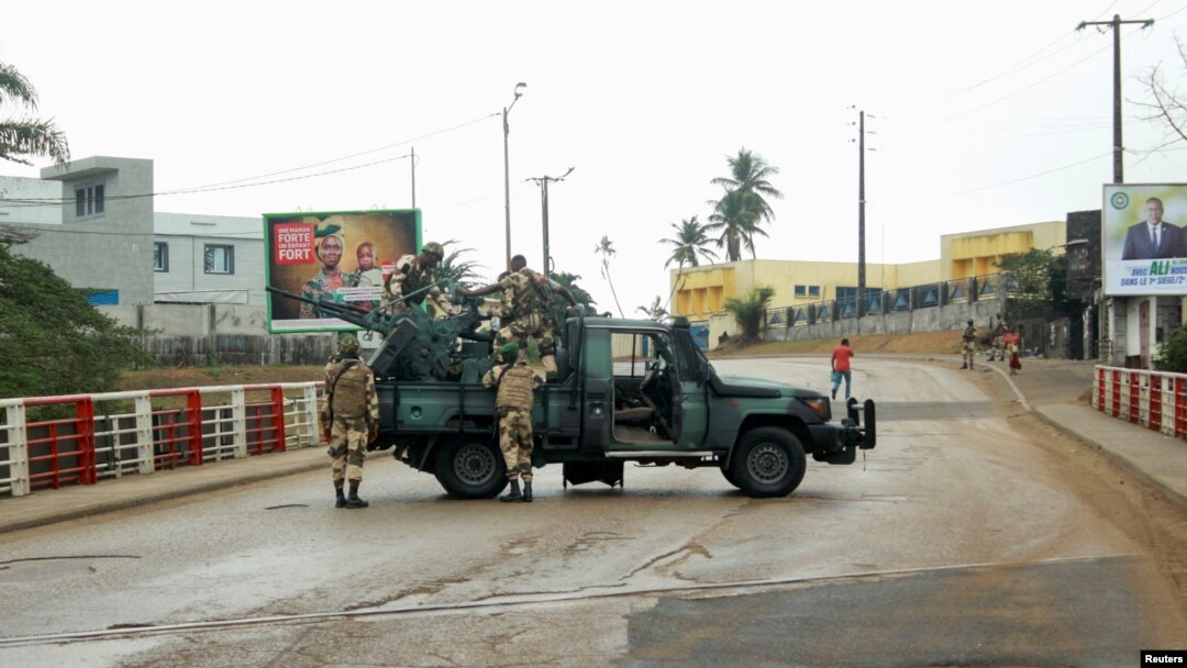 Soldiers of the Republican Guard stand on their armed pick-up in a street in Libreville, Gabon, Aug. 30, 2023.