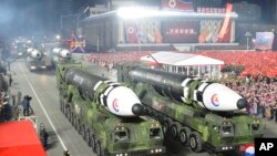This photo provided by the North Korean government, shows what it says is Hwasong-17 intercontinental ballistic missiles during a military parade in Pyongyang, North Korea, Feb. 8, 2023. 