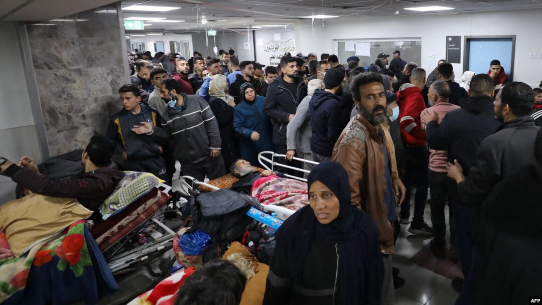 Injured people receive treatment in Gaza City's Al-Shifa hospital, following a reported Israeli strike, that according to Gaza's Health Ministry, killed at least 20 and wounded more than 150 as they waited for humanitarian aid, on Jan. 25, 2024.