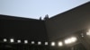 FILE - Security personnel watch from the roof during a rugby match at Geoffroy Guichard stadium in Saint-Etienne, France, Sept. 17, 2023. Security services arrested a man suspected of plotting an attack on a soccer game during the Olympic Games, an official said on May 31, 2024. 