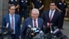FILE - Former Senator Bob Menendez, center, speaks to reporters as he leaves federal court in New York, July 16, 2024.