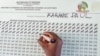 A worker from the National Electoral Commission (NEC) tallies casted ballots in favor of the Rwanda's incumbent President Paul Kagame at the G.S. Kagugu polling center in Kinyinya, Gasabo district of Kigali, July 15, 2024.