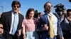FILE - Amanda Knox arrives with her husband Christopher Robinson, right, and her lawyer Luca Luparia Donati at the Florence courtroom in Florence, Italy, June 5, 2024. 