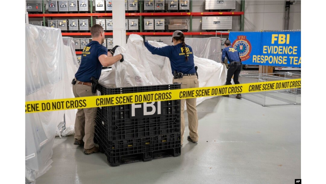 In this image provided by the FBI, FBI special agents process material recovered from the high altitude balloon recovered off the coast of South Carolina, Thursday, Feb. 9, 2023, at the FBI laboratory in Quantico, Va., (FBI via AP)