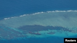 FILE - An aerial view shows the Second Thomas Shoal — and the World War II-era ship grounded on it — in the South China Sea, March 9, 2023.