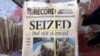 FILE - A stack of the latest weekly edition of the Marion County Record sits in the back of the newspaper's building, awaiting unbundling, sorting and distribution, Aug. 16, 2023, in Marion, Kan.