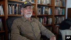 Journalist Gustavo Gorriti poses for a portrait at his home in Lima, Peru, April 26, 2024. 