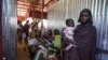 FILE - A woman and baby wait in line at the Zamzam displacement camp, close to El Fasher in North Darfur, Sudan, in January 2024. The United Nations on April 26, 2024, is warning of renewed and escalating violence in the area. (MSF/Mohamed Zakaria/Handout via Reuters)