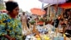FILE - A woman shops at the Mvog Ada market in Yaounde, Cameroon, Jan. 29, 2022. During a protest on March 8, 2023, women asked the government to help them cope with price increases.