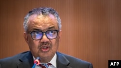 FILE- World Health Organization (WHO) Director-General Tedros Adhanom Ghebreyesus delivers his speech on the opening day of the 77th World Health Assembly, in Geneva, May 27, 2024.