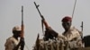 FILE - Sudanese soldiers from the Rapid Support Forces secure the area in the East Nile province, Sudan, June 22, 2019.