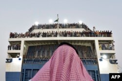A boat with 1,687 civilians from more than 50 countries fleeing violence in Sudan, arrives at King Faisal navy base in Jeddah, Saudi Arabia, Apr. 26, 2023