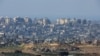 Edifícios em ruínas em Gaza, em meio ao conflito em curso entre Israel e o grupo islâmico palestiniano Hamas, visto do sul de Israel, 30 Dezembro 2023. 