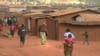 FILE - Refugees from various nationality walk through Dzaleka refugee camp in Dowa District Central region of Malawi on June 20, 2018.