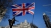 FILE - A British flag flutters in Parliament Square in London, March 29, 2019.