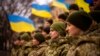 FILE - Ukrainian soldiers celebrate a Day of Unity in Odesa, Ukraine, Feb. 16, 2022. A Ukrainian court recently found blogger Wang Jixian, a software engineer from Beijing who lives in Odesa, guilty of posting videos that could harm national security.