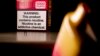 FILE — A health warning is seen on the packaging of a disposable vaping pod device in Washington, June 26, 2023.