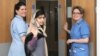 This photo made available by Queen Elizabeth Hospital shows Malala Yousafzai saying goodbye as she is discharged from the hospital to continue her rehabilitation at her family’s temporary home in the area, Jan. 4, 2013.