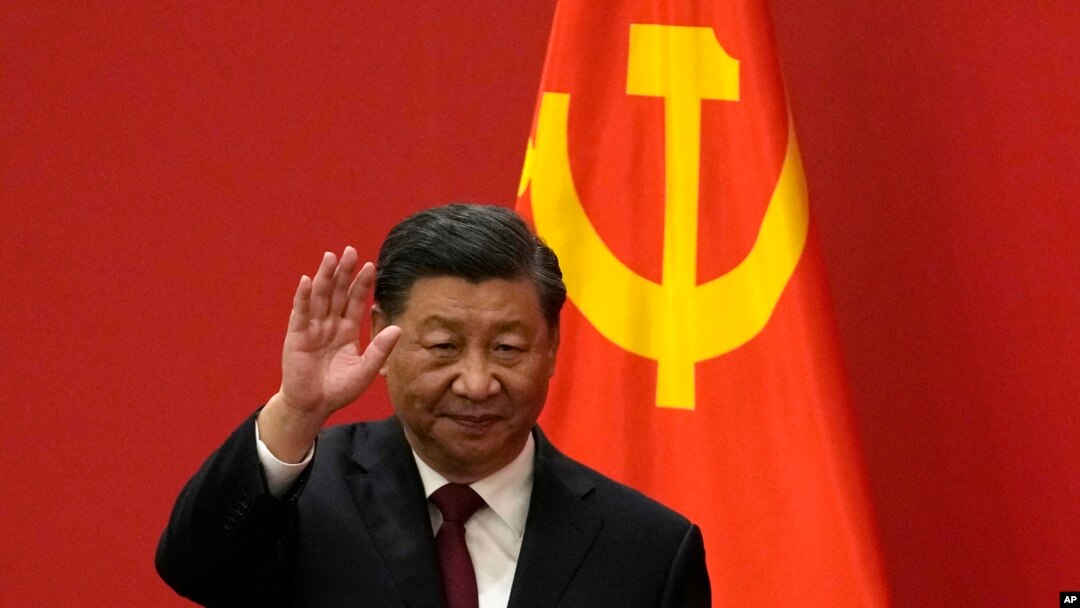 FILE - Chinese President Xi Jinping waves at an event to introduce new members of the Politburo Standing Committee at the Great Hall of the People in Beijing on Oct. 23, 2022. (AP Photo/Andy Wong, File)