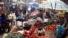 FILE - Vendors and shoppers are seen the Mvog Ada market in Yaounde, Cameroon, Jan. 29, 2022.