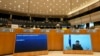 Ukraine's President Volodymyr Zelenskyy addresses the Plenary, via remote link, during an extraordinary session on Ukraine at the European Parliament in Brussels, March 1, 2022.