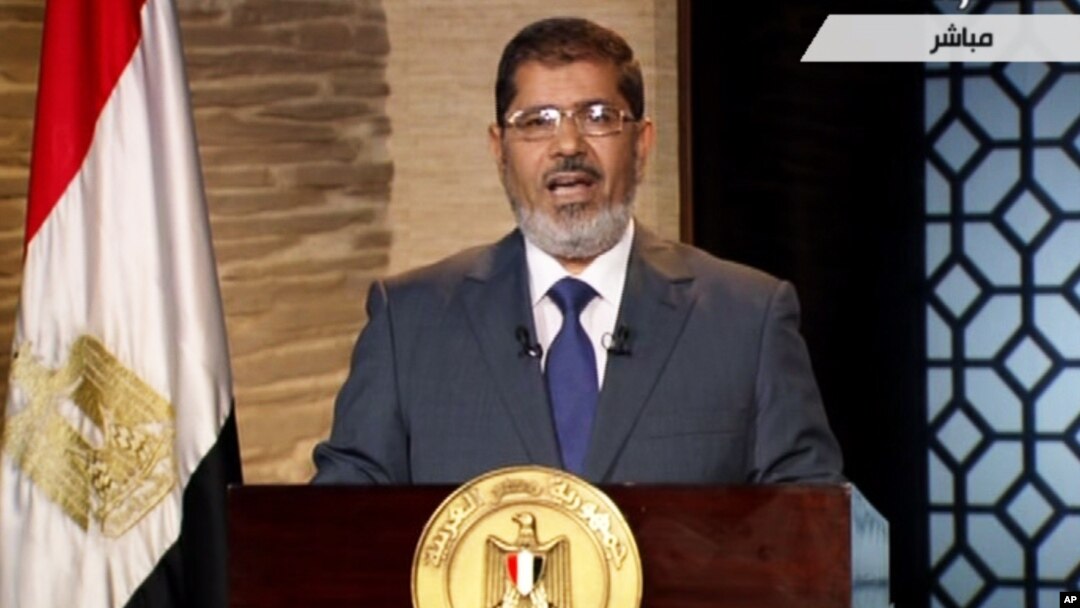 In this image taken from Egypt State TV, newly-elect President Mohammed Morsi delivers a speech in Cairo, Egypt, Sunday, June 24, 2012. 