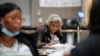 Workers count absentee ballots at the Wisconsin Center for the midterm election, Nov. 8, 2022, in Milwaukee. 