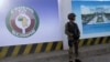 A Nigerian soldier stands outside the new construction site of the headquarters of the Economic Community of West African States (ECOWAS) during the 62nd Ordinary Session of ECOWAS Authority of Heads of State and Government in Abuja, Dec. 4, 2022. 