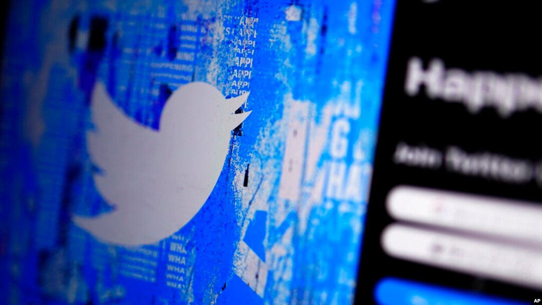 FILE - The Twitter splash page is seen on a digital device, April 25, 2022, in San Diego. European Union data show that Twitter took longer to review hateful content and removed less of it in 2022 compared with the previous year. 