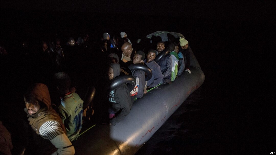 Migrants off the coast of Libya wait on an inflatable boat for rescue by the nongovernmental organization Proactiva Open Arms.