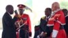 FILE - Tanzania's President-elect John Magufuli (L) takes the Oath of Office during his inauguration ceremony at the Uhuru Stadium in Dar es Salaam, Nov. 5, 2015. 