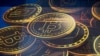 FILE - An advertisement for Bitcoin, one of the cryptocurrencies, is displayed on a building in Hong Kong, Nov. 18, 2021. The Central African Republic, along with El Salvador, has recognized the use of Bitcoin as legal tender. 