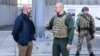 A handout picture, taken and released by Ukrainian Prime Minister Press Service on May 9, 2022, shows European Council President Charles Michel (left) listening to Ukraine's Prime Minister Denys Shmyhal during their meeting in the southern Ukrainian port.