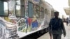 FILE - A police officer walks past a train at the train station in Abuja, Nigeria, Dec. 5, 2022. 