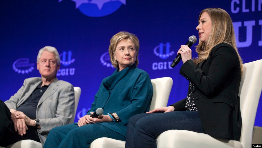 FILE - The Clintons — Bill, Hillary and daughter Chelsea — speak at a 2014 Clinton Global Initiative event at Arizona State University in Tempe. 