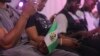 A man holds a Nigerian flag in Lagos on Oct. 20, 2022, during a commemoration of the #EndSARS protests. Nigerians were in shock two years ago after a deadly shooting of peaceful protesters in Lagos that Amnesty International blamed on security forces.
