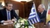 German Finance Minister Wolfgang Schaeuble (R) meets Greek Prime Minister Antonis Samaras in Athens, July 18, 2013. 