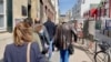 People waiting to vote in the first round of presidential elections in northern Paris. (Lisa Bryant/VOA)