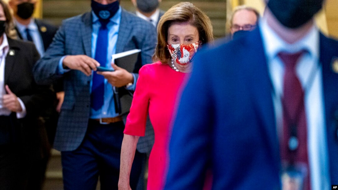House Speaker Nancy Pelosi of California arrives for a House Democratic caucus meeting on Capitol Hill in Washington, Sept. 28, 2021. 