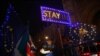 Anti-Brexit demonstrators stand outside the Houses of Parliament in London, Sept. 9, 2019.