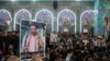 Mourners attend a funeral of Iraqi civil society activist Ehab al-Wazni, who was killed by unidentified gunmen, in Karbala, Iraq, May 9, 2021. 