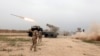 FILE - Iraqi soldiers fire a rocket toward Islamic State militants on the outskirts of Makhmour south of Mosul, Iraq, March 25, 2016. Iraq's security forces have announced the start of an operation to retake control of Ar-Rutbah, a town in western Anbar province.